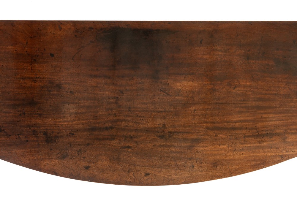 An 18th-century Georgian mahogany serving table featuring a curved apron with central oval inlay and four tapered square legs. View IX