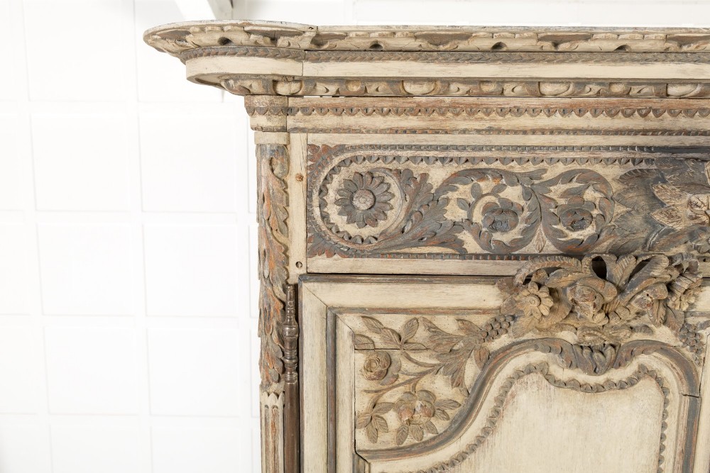An eighteenth-century carved French painted oak armoire featuring two doors with ornate floral mouldings and short cabriole feet. View II