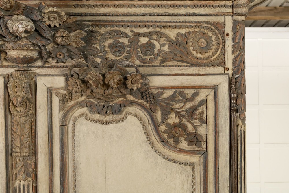 An eighteenth-century carved French painted oak armoire featuring two doors with ornate floral mouldings and short cabriole feet. View IV
