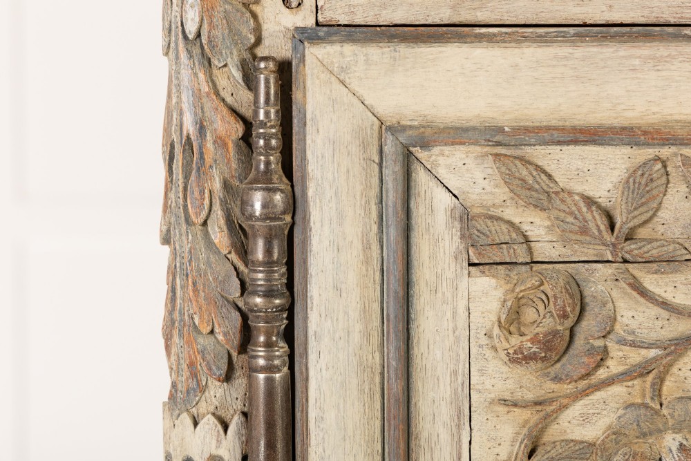 An eighteenth-century carved French painted oak armoire featuring two doors with ornate floral mouldings and short cabriole feet. View V