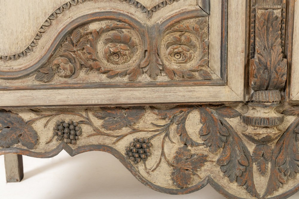 An eighteenth-century carved French painted oak armoire featuring two doors with ornate floral mouldings and short cabriole feet. View XII