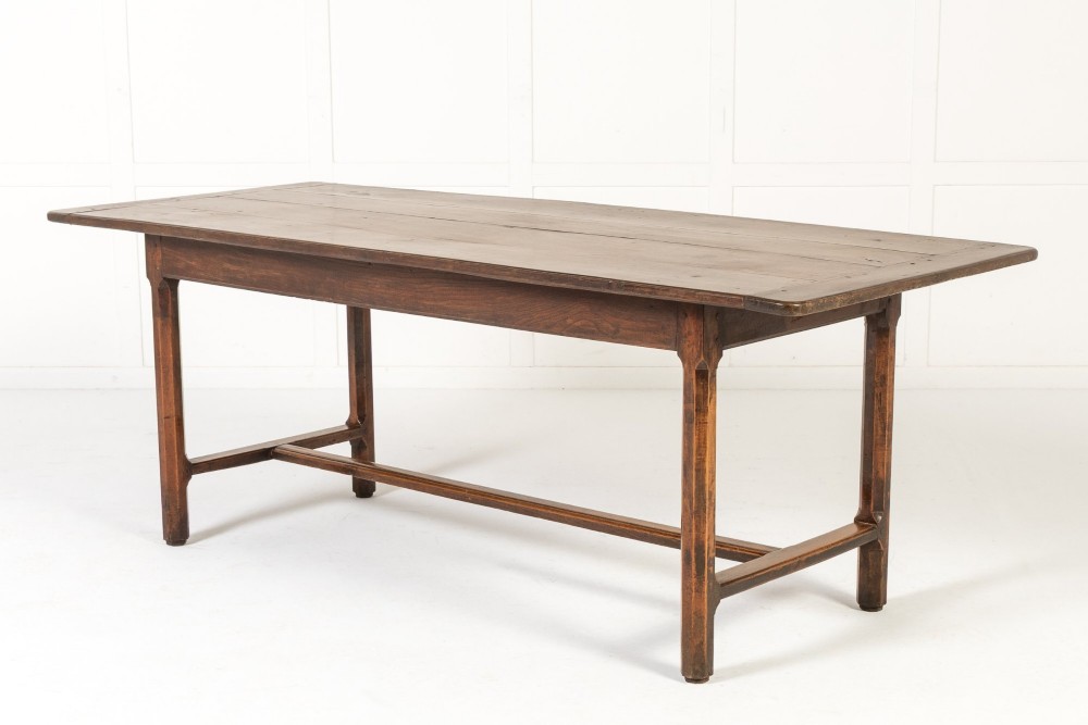 An 18th-century George III oak farmhouse dining table with a rectangular plank top and straight legs joined by low stretchers. View II