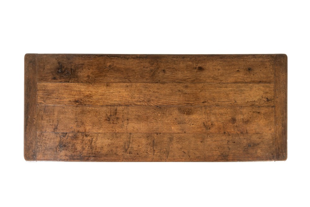 An 18th-century George III oak farmhouse dining table with a rectangular plank top and straight legs joined by low stretchers. View V