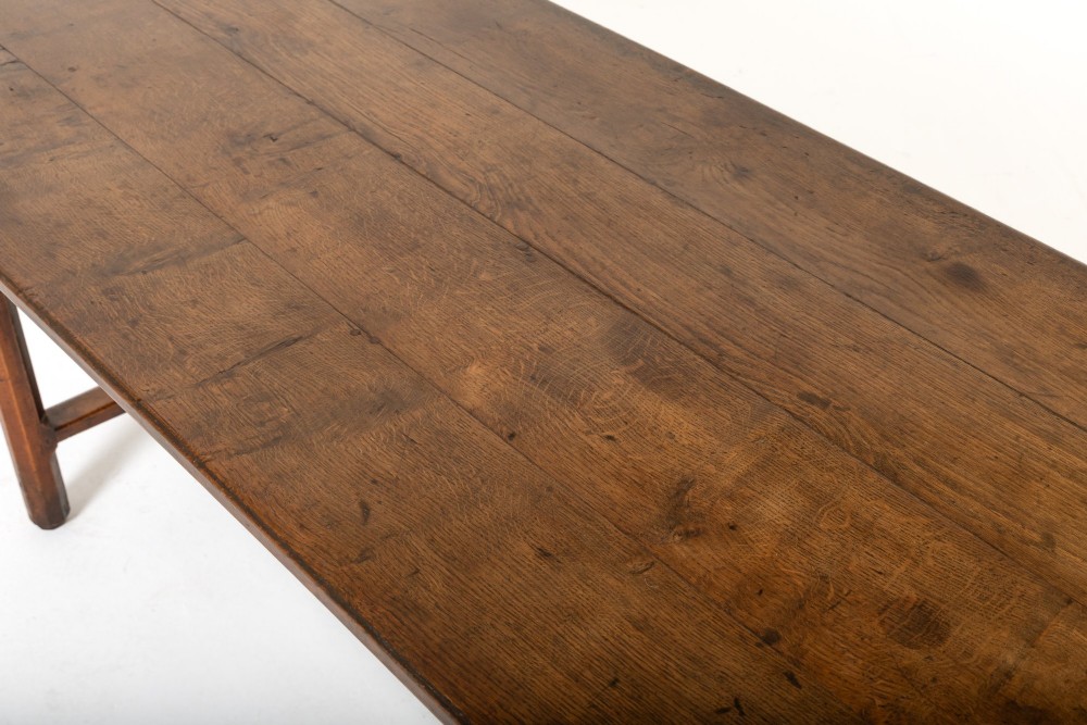 An 18th-century George III oak farmhouse dining table with a rectangular plank top and straight legs joined by low stretchers. View VI