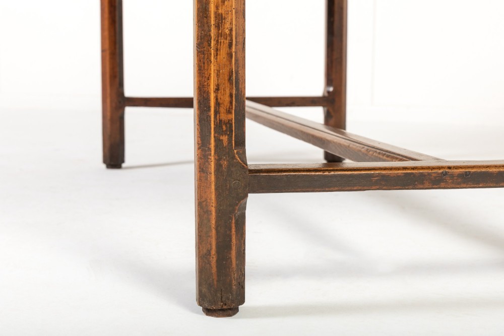 An 18th-century George III oak farmhouse dining table with a rectangular plank top and straight legs joined by low stretchers. View IX