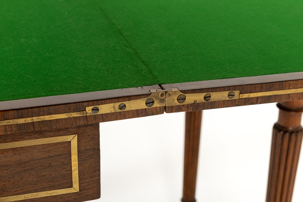 A pair of 19th-century English Regency rosewood foldover card tables with brass stringing inlay and fluted tapered legs. View VII