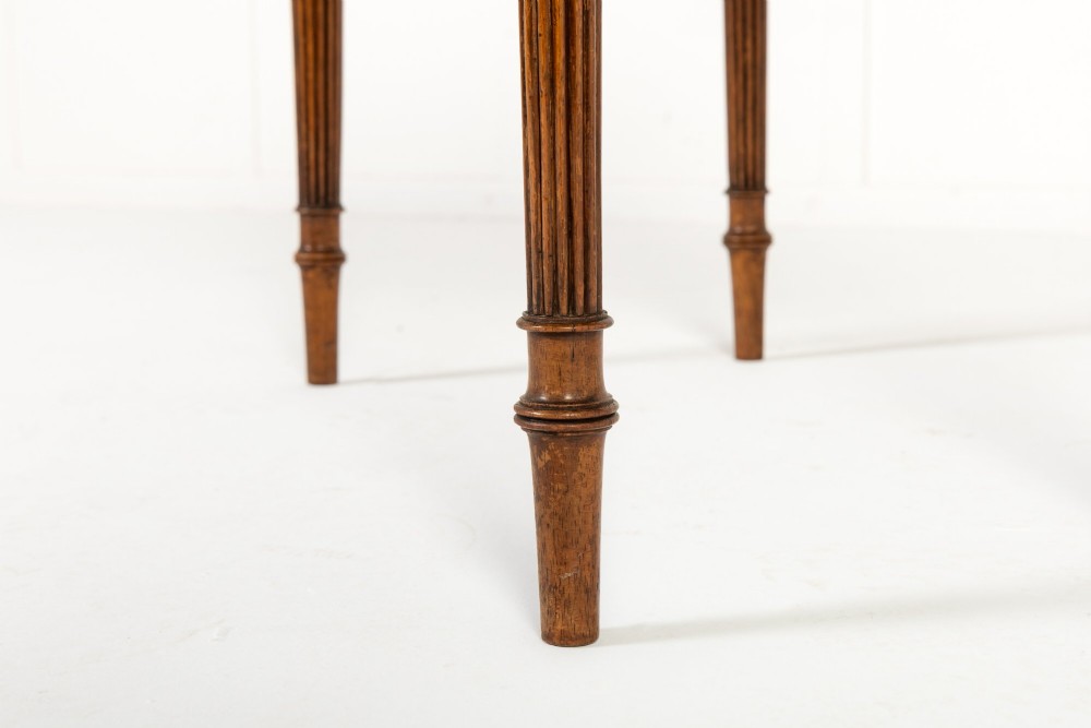 A pair of 19th-century English Regency rosewood foldover card tables with brass stringing inlay and fluted tapered legs. View XI