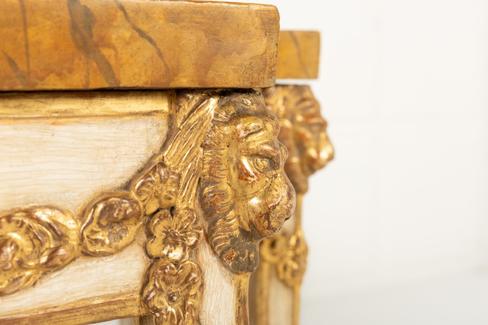 A 19th-century Italian Neoclassical console table featuring a painted cream frame, carved parcel gilt floral swags, tapered legs, and a marble top. View VIII