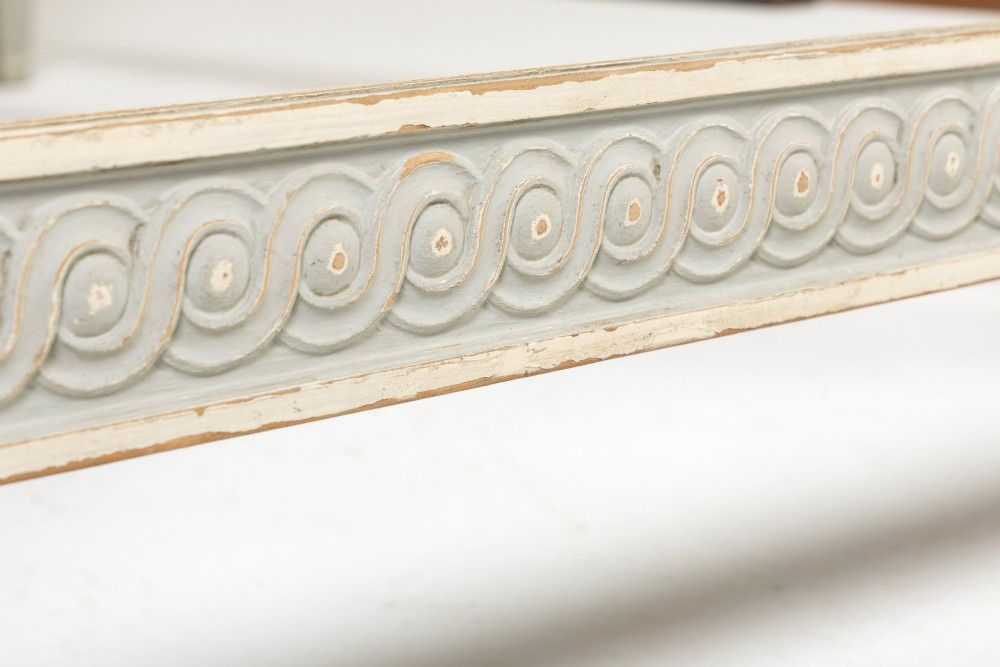 A 19th-century French Neoclassical double bed frame with a light grey painted finish, fluted posts topped with finials, and an arched cream upholstered headboard. View VII