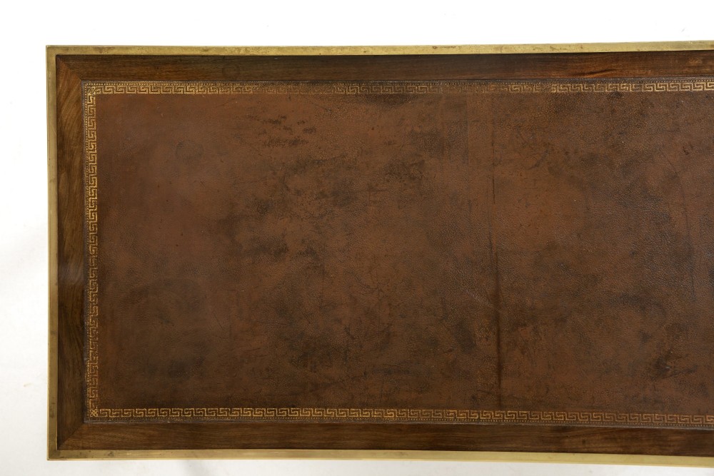 A 19th-century French Louis XVI style bureau plat writing desk featuring geometric parquetry inlay, three frieze drawers, a leather top insert, and brass mounts on square tapered legs. View VII