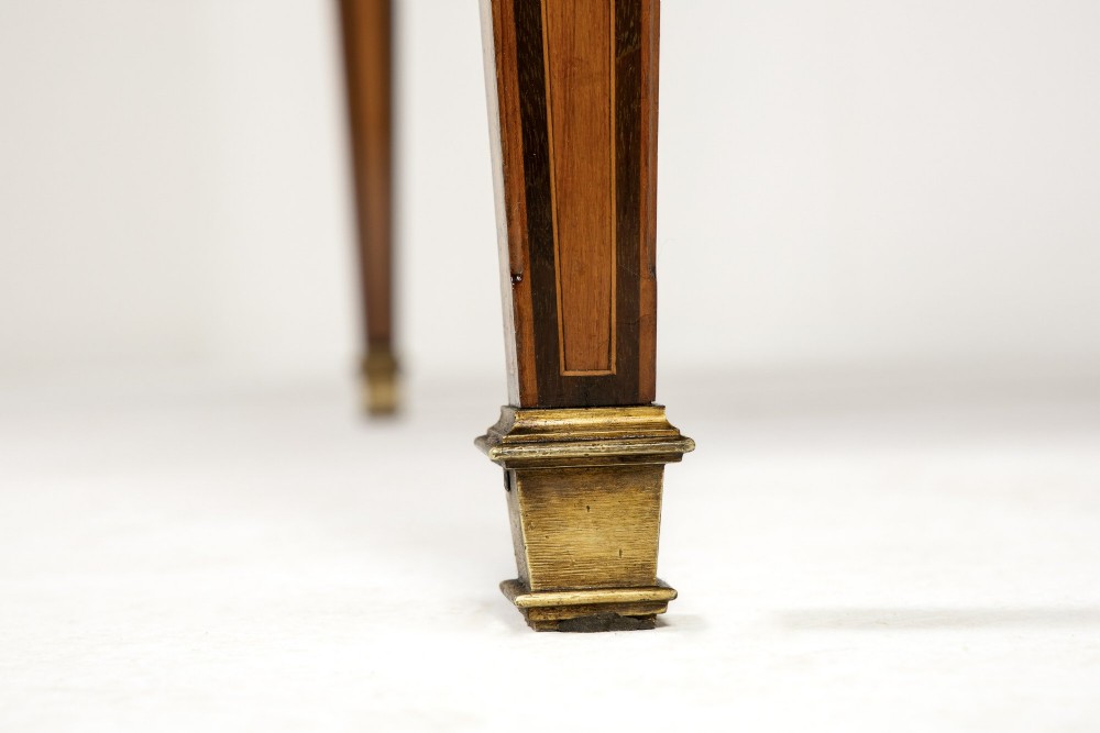 A 19th-century French Louis XVI style bureau plat writing desk featuring geometric parquetry inlay, three frieze drawers, a leather top insert, and brass mounts on square tapered legs. View XIII