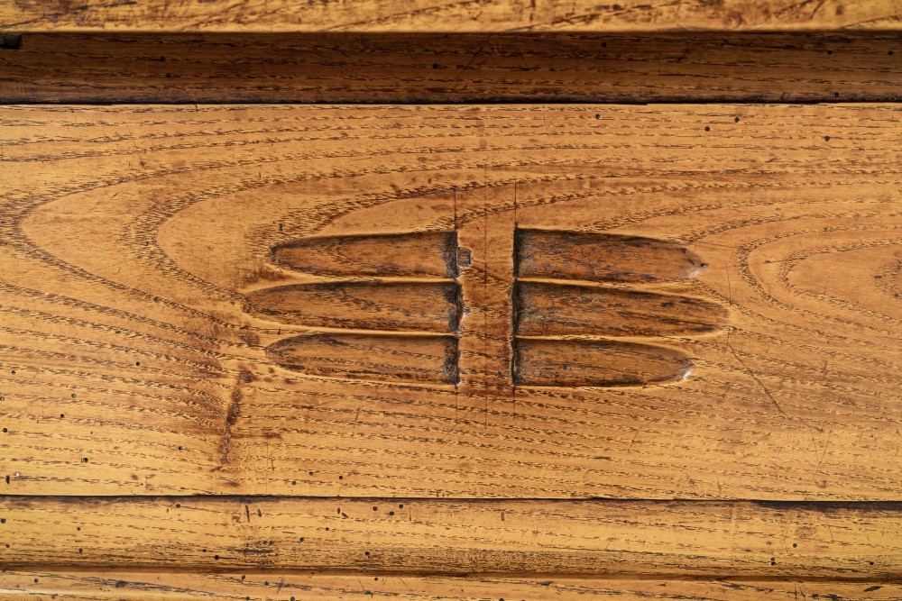 A long, rectangular 18th-century French oak table featuring two drawers with carved recessed pulls and lower stretchers connecting the legs. View II