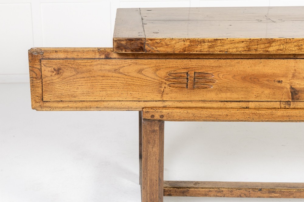 A long, rectangular 18th-century French oak table featuring two drawers with carved recessed pulls and lower stretchers connecting the legs. View IV