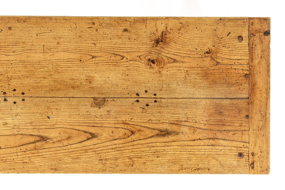 A long, rectangular 18th-century French oak table featuring two drawers with carved recessed pulls and lower stretchers connecting the legs. View IX
