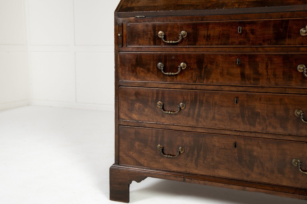 An 18th-century Georgian mahogany bureau bookcase featuring a twin-door upper cabinet with astragal glazing bars over a slant-front writing slope and four graduated drawers on bracket feet. View II