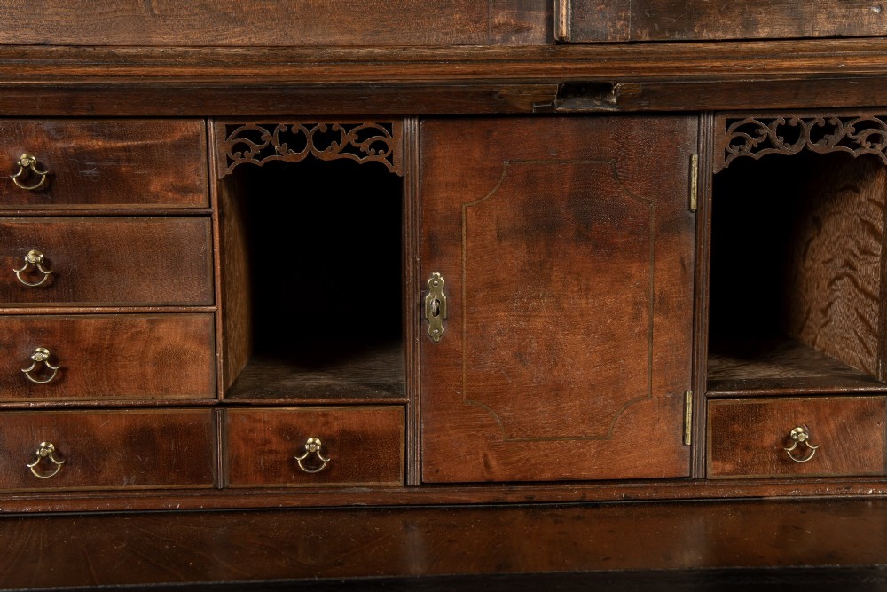 An 18th-century Georgian mahogany bureau bookcase featuring a twin-door upper cabinet with astragal glazing bars over a slant-front writing slope and four graduated drawers on bracket feet. View XI