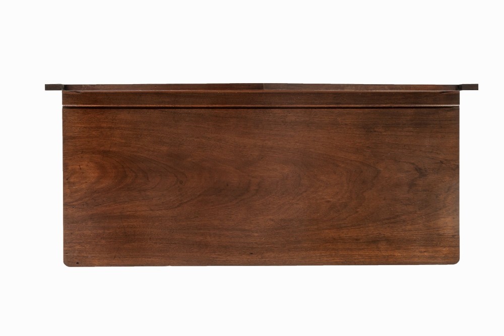 A 19th-century Regency mahogany serving table featuring a pointed splashback upstand, decorative carved frieze, turned front legs, and carved lion paw feet. View VI