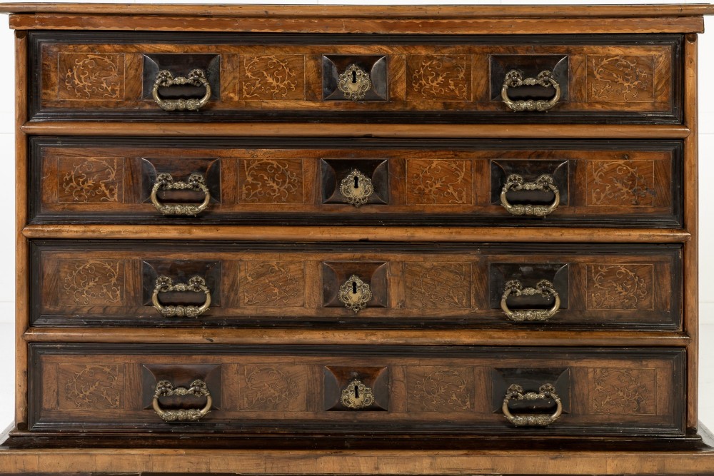 An 18th-century Italian walnut chest of drawers featuring foliage marquetry, brass drop handles, and geometric side moulding. View II