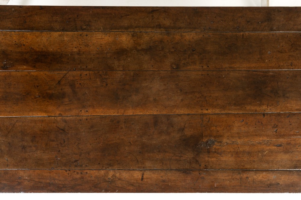 An 18th-century French cherrywood rectangular farmhouse dining table featuring a framed plank top, frieze drawer, and tapered legs. View III