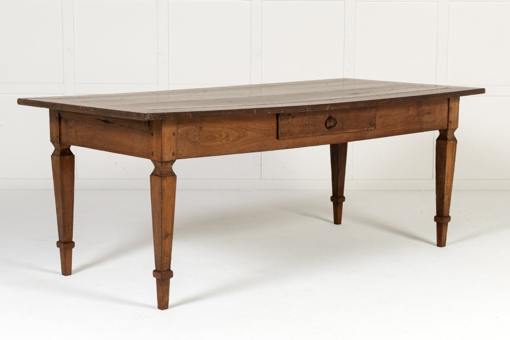 An 18th-century French cherrywood rectangular farmhouse dining table featuring a framed plank top, frieze drawer, and tapered legs. View IV