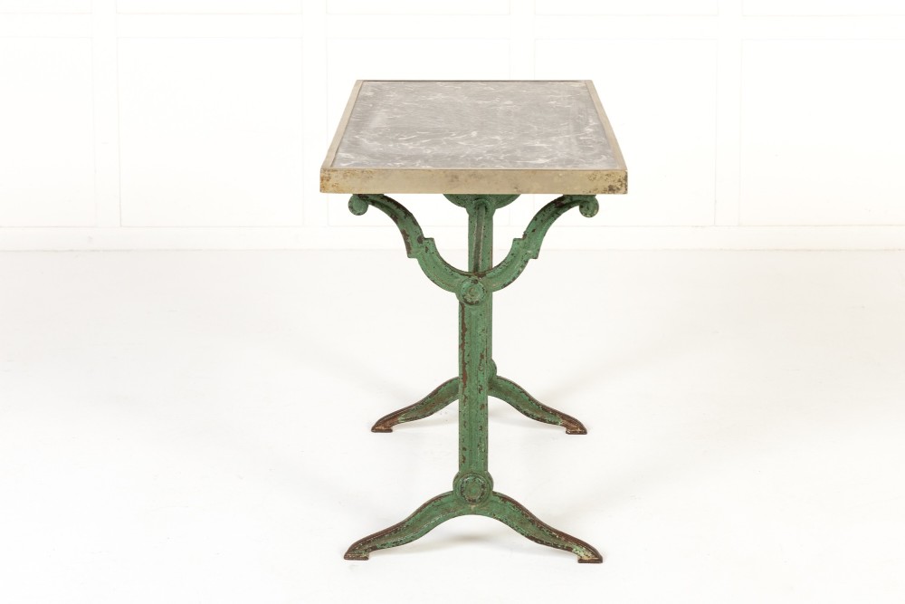 A pair of 19th-century bistro tables featuring rectangular grey veined marble tops framed in brass above weathered green-painted cast iron bases. View III