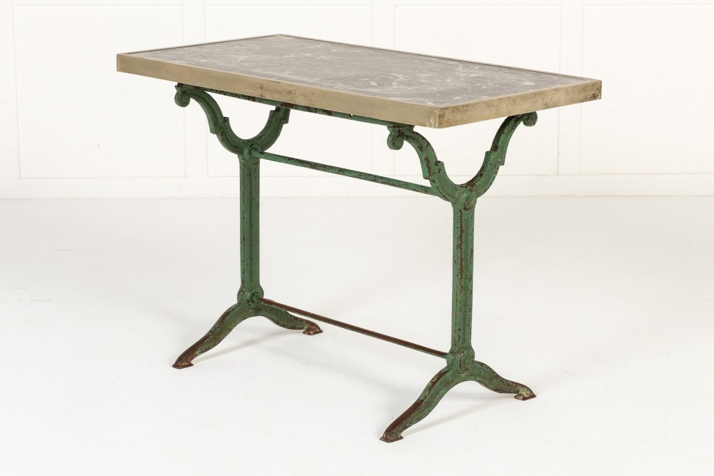 A pair of 19th-century bistro tables featuring rectangular grey veined marble tops framed in brass above weathered green-painted cast iron bases. View IV