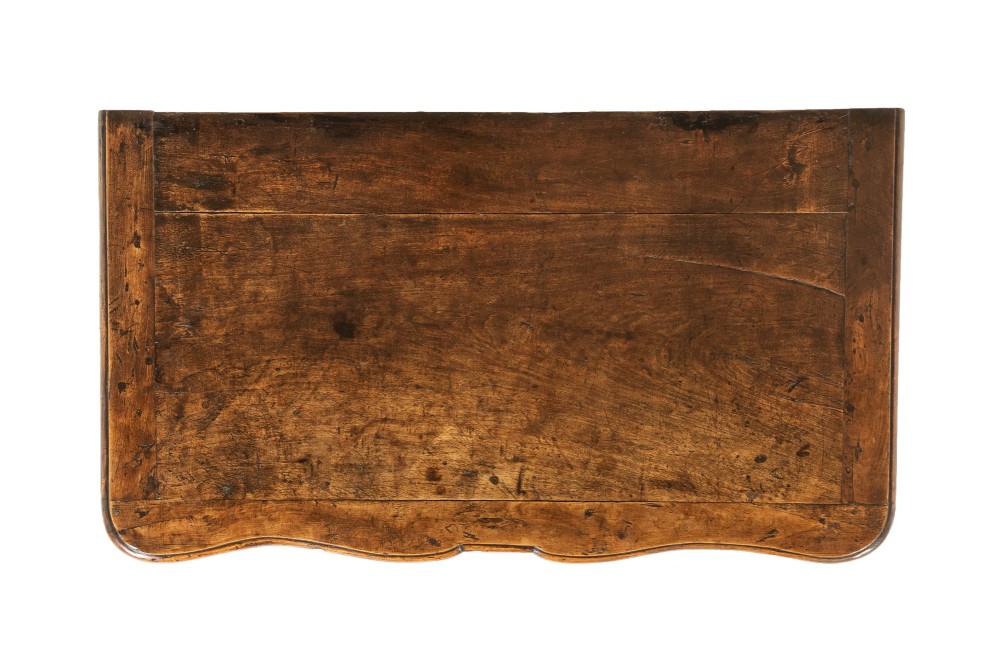 An 18th-century French walnut commode featuring two drawers with cast brass handles, a serpentine front, and cabriole legs. View IV