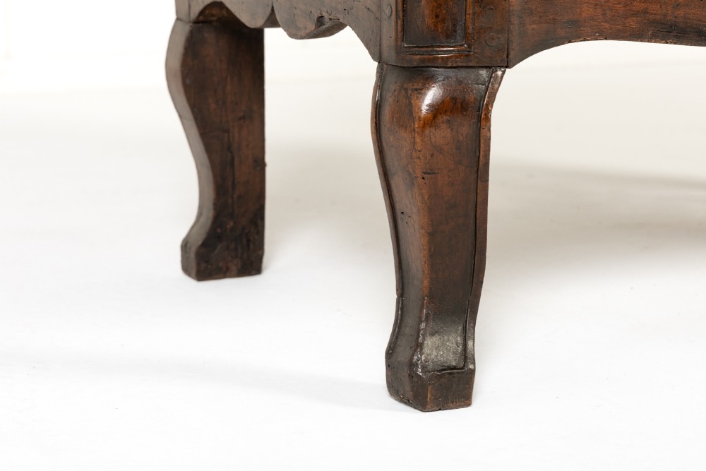 An 18th-century French walnut commode featuring two drawers with cast brass handles, a serpentine front, and cabriole legs. View VI