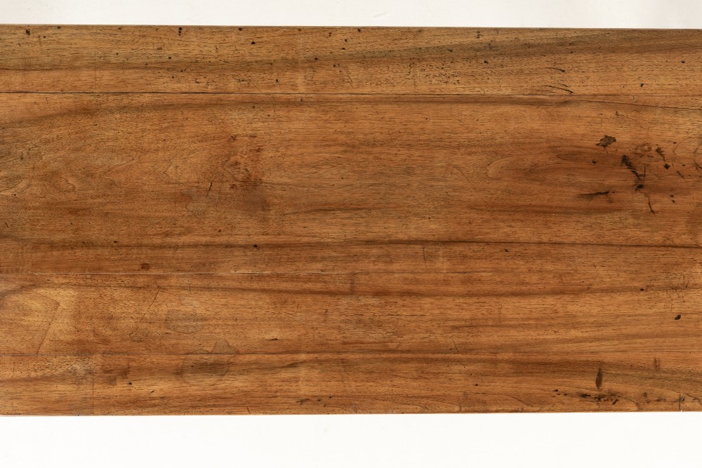 A 19th-century French walnut drapers table with three drawers, wooden knobs, a central keyhole, and turned legs with lower stretchers. View IV