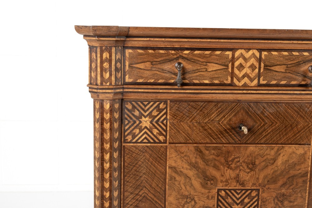 A tall nineteenth-century Italian secretaire cabinet featuring geometric marquetry veneer, a drop-front fall, and stacked drawers. View III