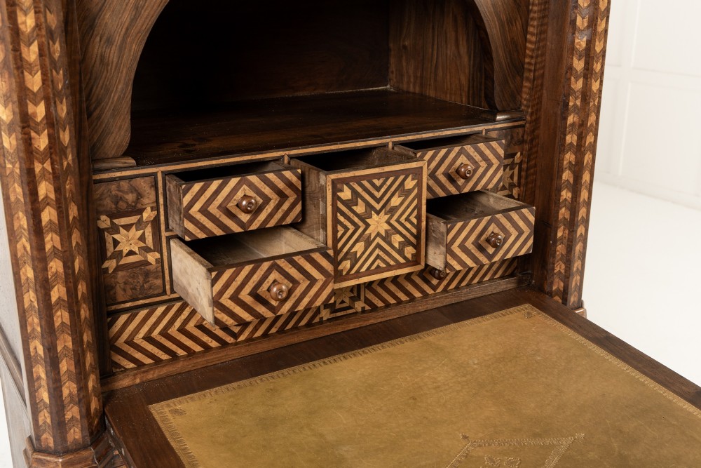 A tall nineteenth-century Italian secretaire cabinet featuring geometric marquetry veneer, a drop-front fall, and stacked drawers. View VII