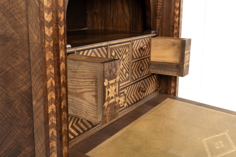 A tall nineteenth-century Italian secretaire cabinet featuring geometric marquetry veneer, a drop-front fall, and stacked drawers. View VIII