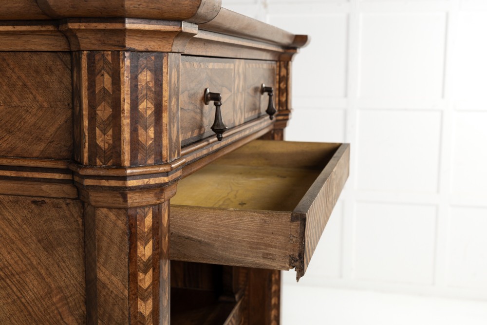 A tall nineteenth-century Italian secretaire cabinet featuring geometric marquetry veneer, a drop-front fall, and stacked drawers. View IX
