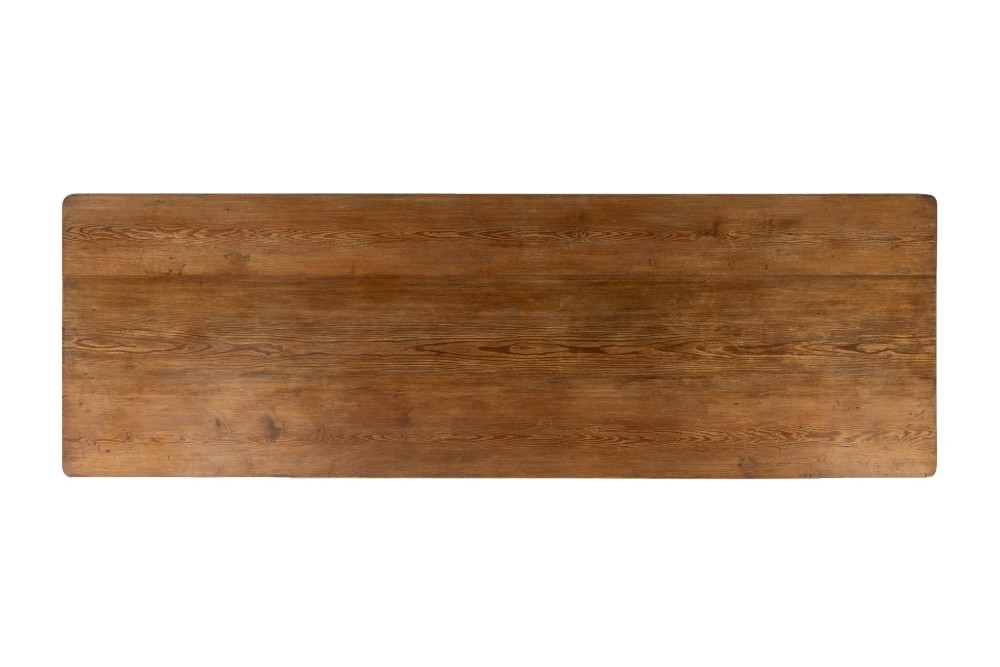 An English pine refectory dining table featuring a rectangular plank top resting on an X-frame trestle base with a central stretcher. View III