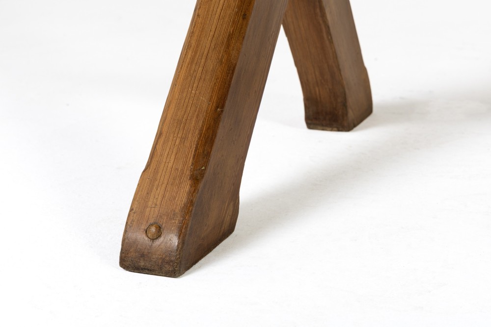 An English pine refectory dining table featuring a rectangular plank top resting on an X-frame trestle base with a central stretcher. View VII