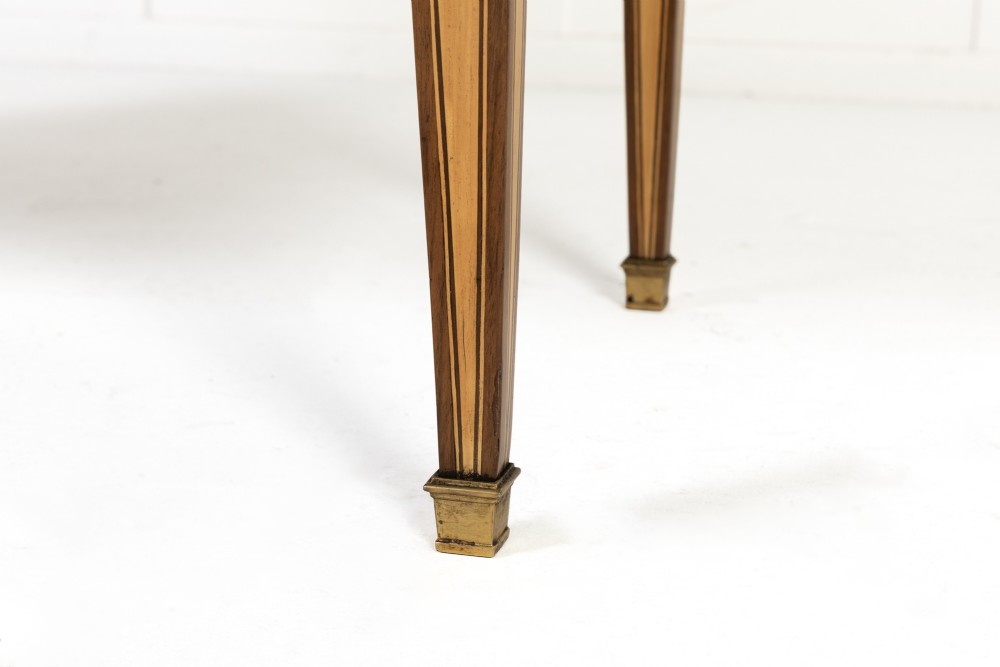 A pair of 18th-century Italian Neoclassical chests of drawers featuring geometric wood inlays, brass ring handles, light marble tops, and tapered square legs. View XI