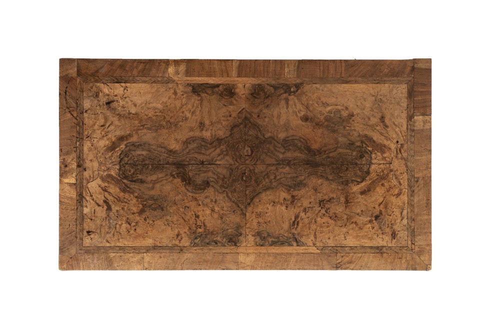 An 18th-century English burr walnut chest of drawers featuring two short over three long drawers with brass drop handles and turned bun feet. View III