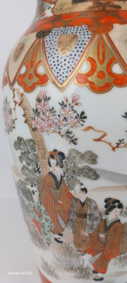 A pair of baluster-shaped Japanese Kutani porcelain vases decorated with hand-painted birds, flowers, iron-red panels, and gold accents. View VIII