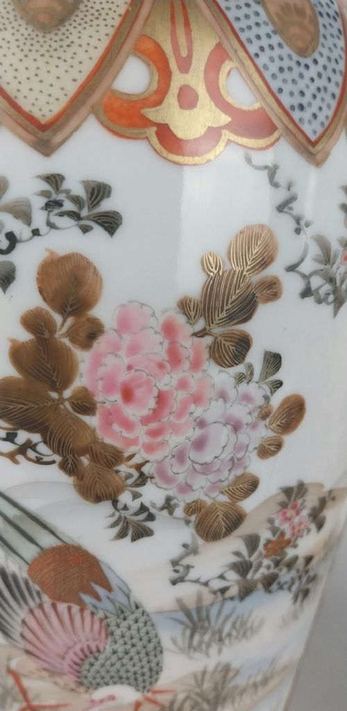 A pair of baluster-shaped Japanese Kutani porcelain vases decorated with hand-painted birds, flowers, iron-red panels, and gold accents. View XII