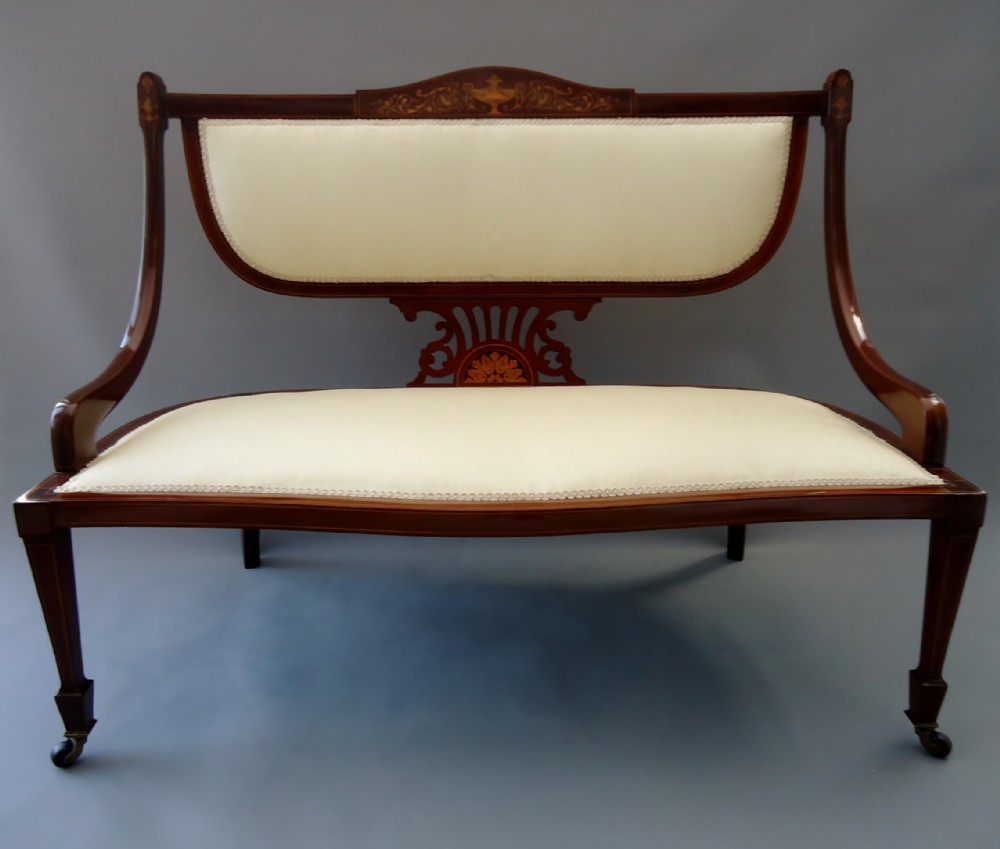 A mahogany inlaid edwardian period antique settee