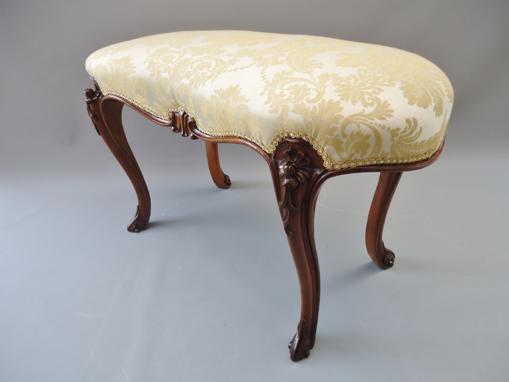 A Victorian walnut kidney shape victorian stool
