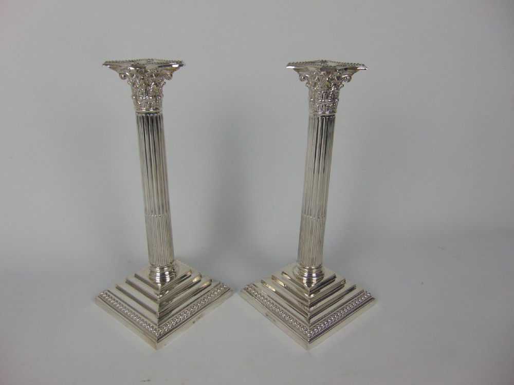 A fine pair of silver candlesticks  View V