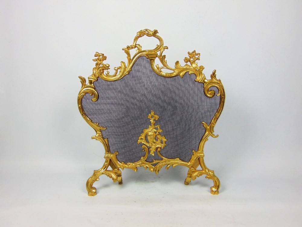 A fabulous gilt bronze fire screen