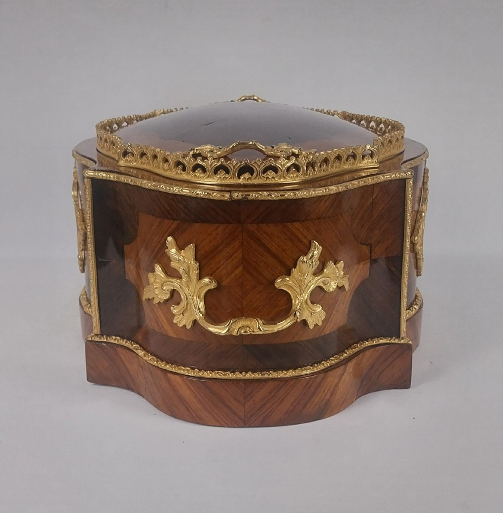 A late 19th-century French serpentine table jardiniere constructed from kingwood and tulipwood parquetry, featuring gilt bronze mounts and a central oval hand-painted porcelain medallion depicting a cherub. View VII