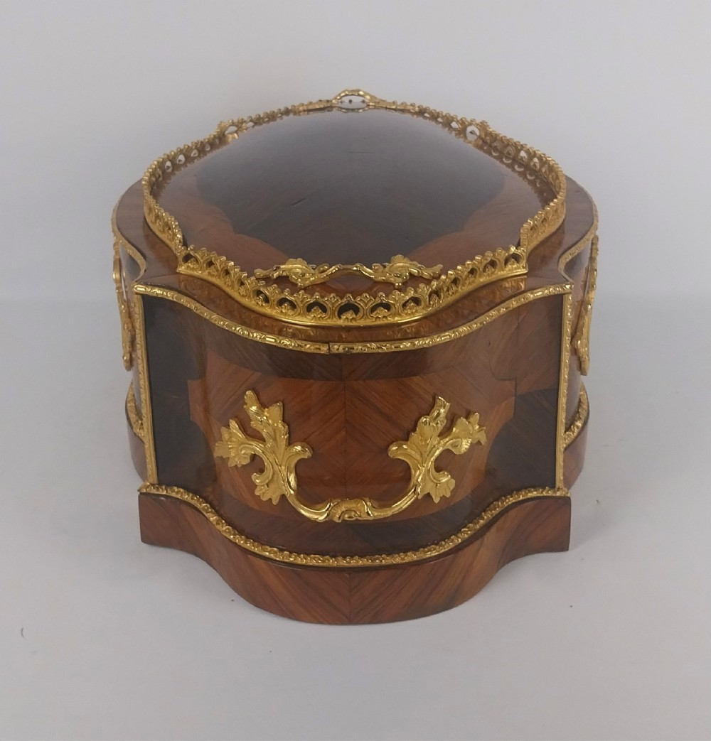 A late 19th-century French serpentine table jardiniere constructed from kingwood and tulipwood parquetry, featuring gilt bronze mounts and a central oval hand-painted porcelain medallion depicting a cherub. View VIII