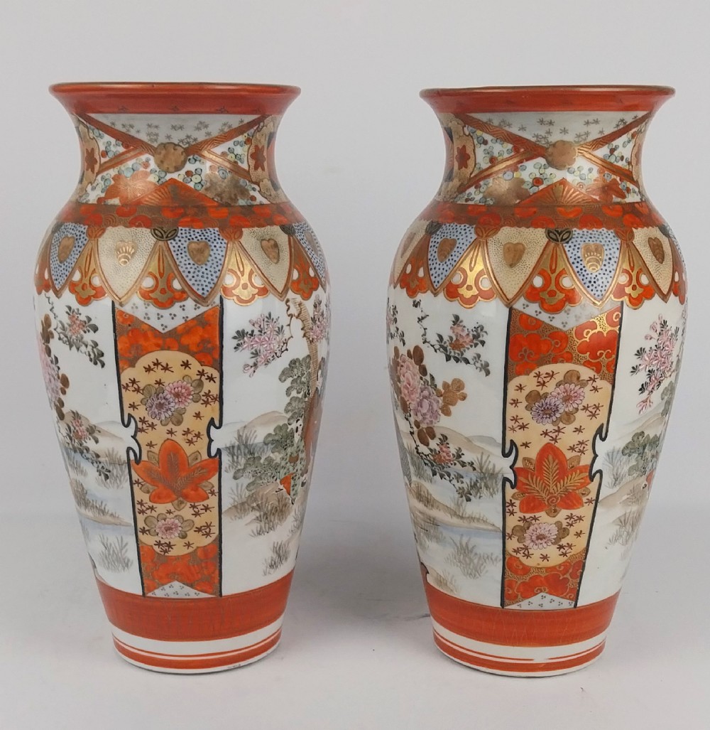 A pair of baluster-shaped Japanese Kutani porcelain vases decorated with hand-painted birds, flowers, iron-red panels, and gold accents. View IV