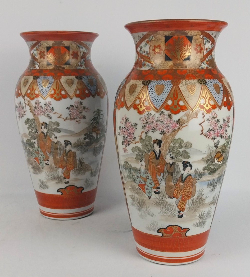 A pair of baluster-shaped Japanese Kutani porcelain vases decorated with hand-painted birds, flowers, iron-red panels, and gold accents. View V