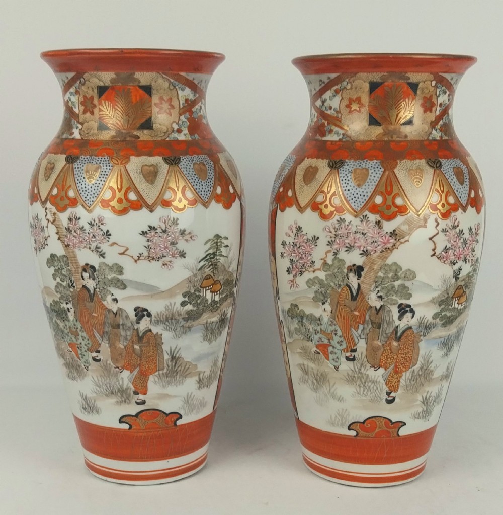 A pair of baluster-shaped Japanese Kutani porcelain vases decorated with hand-painted birds, flowers, iron-red panels, and gold accents. View VI