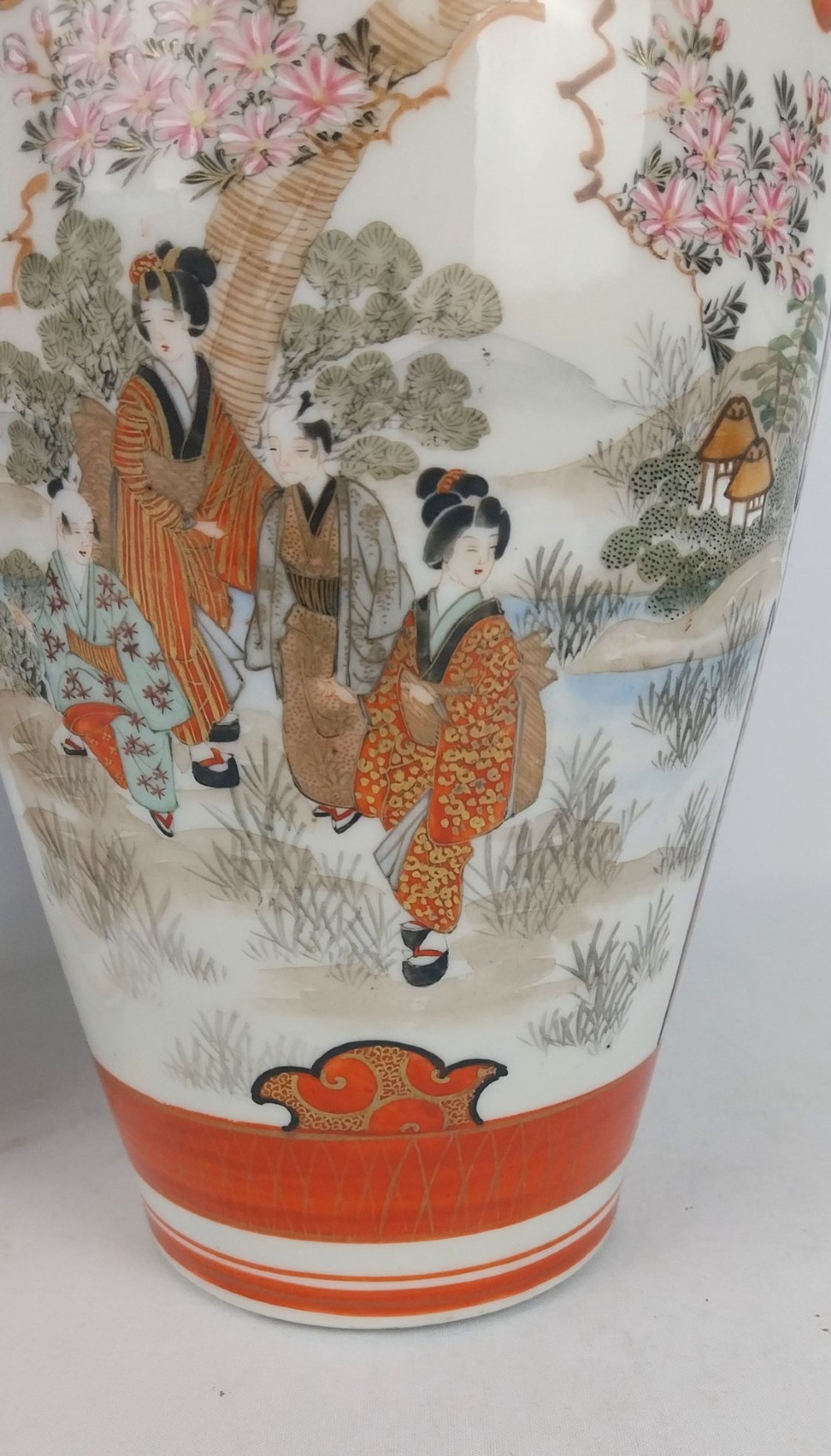 A pair of baluster-shaped Japanese Kutani porcelain vases decorated with hand-painted birds, flowers, iron-red panels, and gold accents. View VII