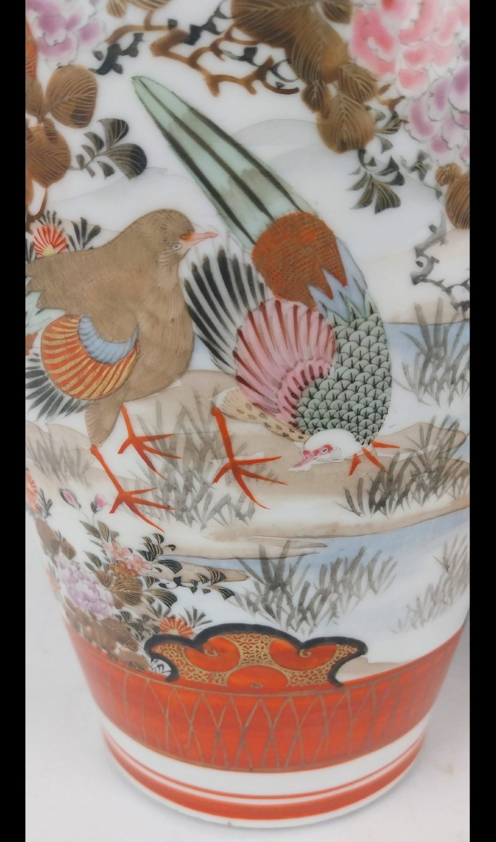 A pair of baluster-shaped Japanese Kutani porcelain vases decorated with hand-painted birds, flowers, iron-red panels, and gold accents. View XI
